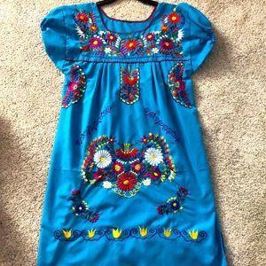 Blue embroidery with floral design. Size S.